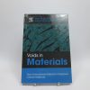 Voids in materials: from unavoidable defects to designed cellular materials